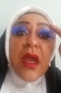 A capture of Sister GlitterNullis as she recognises the magnitude of her calling.